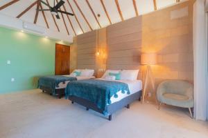 Postel nebo postele na pokoji v ubytování Mayan Playa Bacalar