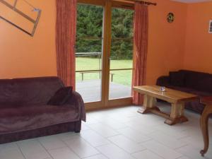 Posezení v ubytování Chalet au bord du lac de Longemer
