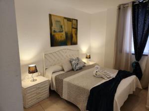 Postel nebo postele na pokoji v ubytování Apartamento Angel Pto Santiago + 24 fotografií