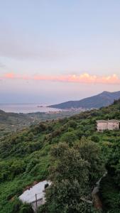 a view of the ocean from a hill at Crissimo apartment in Panagia