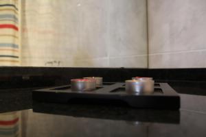 a stove top with four pots on top of it at House4U Vila Nova in Vila Nova de Gaia