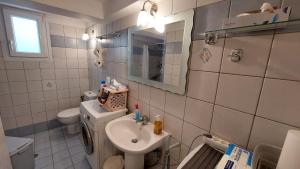 a small bathroom with a sink and a toilet at Belva Blue Naxos Stylish, Naxos Town, near Beach in Naxos Chora +15 photos