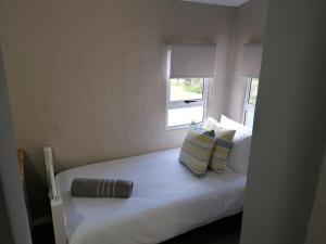 Ένα ή περισσότερα κρεβάτια σε δωμάτιο στο Martinique Cove 18 +8 φωτογραφίες