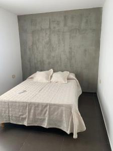 Ένα ή περισσότερα κρεβάτια σε δωμάτιο στο EDIFICIO REY NIÑO
