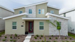 a house with a red door at 9312 SH - Champions Gate - Unique High end 8 Beds in Davenport