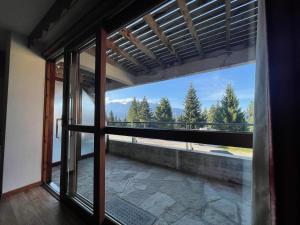 an open window with a view of a mountain view at Droseras A02 - Chamrousse 1700 - Les Villages du Bachat in Chamrousse