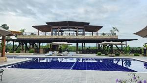 a resort with a swimming pool and a building at Hotel El Cielo en la Tierra in Quimbaya +125 photos