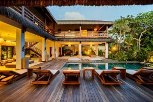 a villa with a swimming pool and a deck at Vila Panhard - Aldeia Jericoacoara Group in Jericoacoara