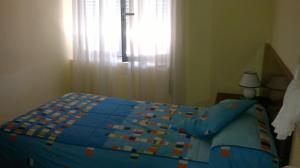 Postel nebo postele na pokoji v ubytování Hostal Residencia Delfin