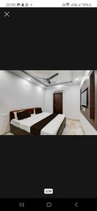a picture of a bedroom with two beds at Star inn hotel in Lucknow