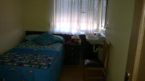 Postel nebo postele na pokoji v ubytování Hostal Residencia Delfin