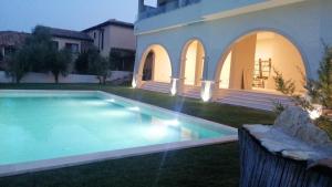 a swimming pool in the yard of a house at Domu sa luna mia in Villasimius