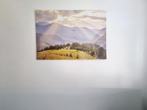 un dipinto di una montagna con un campo giallo di Na Szczycie a Chełm