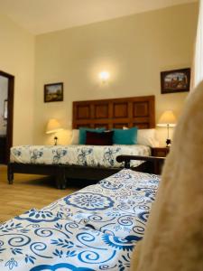 Postel nebo postele na pokoji v ubytování Hotel Doña Chela En Calvillo