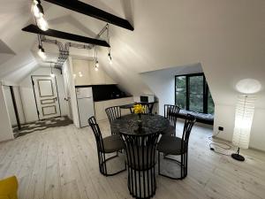 a kitchen and dining room with a table and chairs at Areguni Cottage in Dilijan