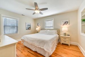 a bedroom with a bed and a ceiling fan at New Bern House with Gas Grill Near Neuse River! in New Bern