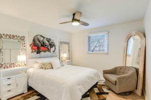 a bedroom with a bed and a chair and a mirror at Pet-Friendly Getaway 15 Mi to Downtown Nashville in Hermitage