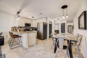 a kitchen and dining room with a table and chairs at Walk to Schlitterbahn, River Access & Pets OK in New Braunfels