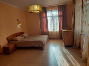 Postel nebo postele na pokoji v ubytování Saulesdarzs