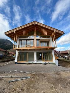 a house being built with a roof on top at Bergblick Chalet in Bayrischzell