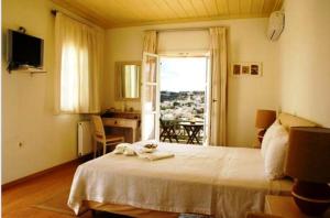 Postel nebo postele na pokoji v ubytování Petali Village Hotel