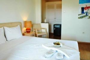 Postel nebo postele na pokoji v ubytování Petali Village Hotel