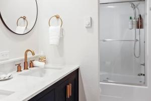 a bathroom with a sink and a shower with a mirror at Cozy Hideaway Retreat Unit 4 near Durango in Durango +11 photos