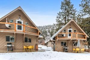 a house in the snow with yellow chairs at Cozy Hideaway Retreat Unit 4 near Durango in Durango