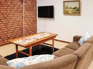 a living room with two couches and a coffee table at Holiday home VÅXTORP II in Våxtorp