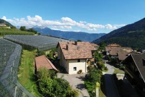 an aerial view of a small village with solar panels at Residence Sonnenburger in Parcines