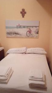 מיטה או מיטות בחדר ב-Casa Anversa