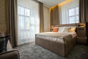 Postel nebo postele na pokoji v ubytování FIMKA Apart Hotel