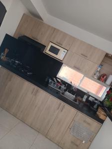 an overhead view of a kitchen with wooden cabinets at Oasis Jamundí in Jamundí