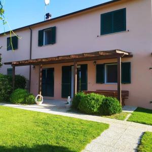 a house with awning on the side of it at Agriturismo Val Molina in Casa Agresti