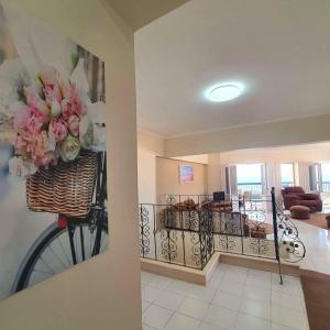 a room with a bike with a basket of flowers at Hotel appartment sea view 3 bedrooms 3 toilets 4th floor Bellevue village agami alexandria families are preferred available all year days & 5 blankets available in Alexandria
