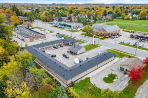 an aerial view of a town with a parking lot at Nights Inn Owen Sound in Owen Sound