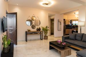 a living room with a couch and a table at Villa Strada Castello in Zakynthos