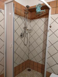 a shower with a glass door in a bathroom at Il Cortile del Castello in Capena +53 photos