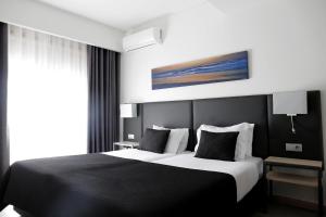 Postel nebo postele na pokoji v ubytování Hotel M