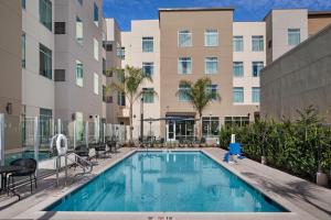 an image of a swimming pool in front of a building at Residence Inn by Marriott Chatsworth in Chatsworth