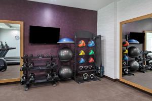 a room with a gym with a rack of helmets at Residence Inn by Marriott Chatsworth in Chatsworth