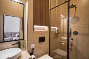 Koupelna v ubytování FIMKA Apart Hotel + 53 fotografií