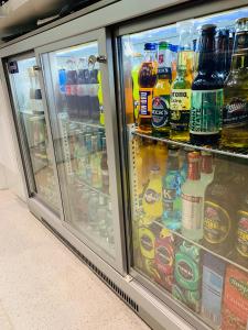 a refrigerator filled with lots of different types of drinks at The Station Hotel in Insch