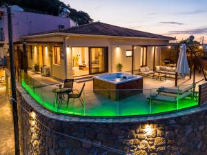 a house with a pool in front of it at Villa Strada Castello in Zakynthos