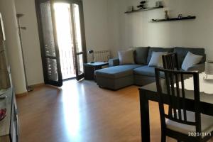 a living room with a couch and a table at CASA RO in Tarragona