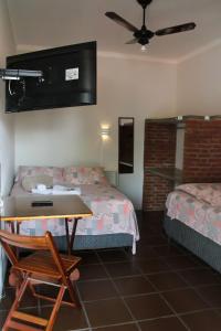เตียงในห้องที่ Piccola Pousada +74 ภาพ
