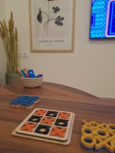 a wooden table with a game on it with scissors at CENTER o'CLOCK in Xanthi
