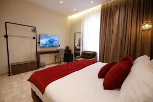 Voodi või voodid majutusasutuse CLOUD 5 Blloku Rooms Tirana toas