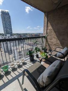 a balcony with a view of a city at Stylish Downtown Calgary Home in Calgary