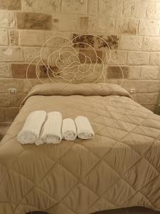 Ένα ή περισσότερα κρεβάτια σε δωμάτιο στο Perlage luxury room and wine